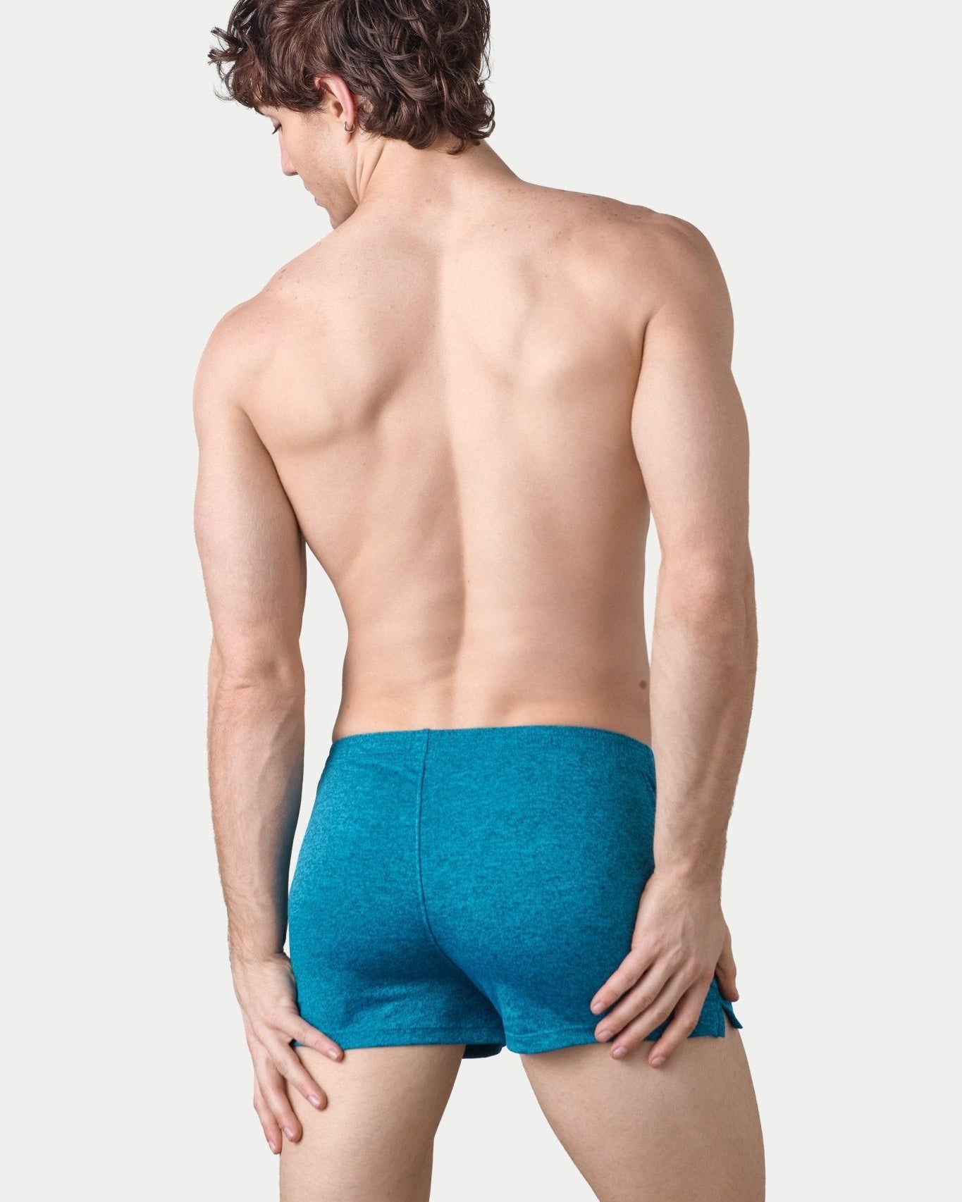 Awry Static Short Azure — close-up of static heather print fabric texture and rubber logo patch