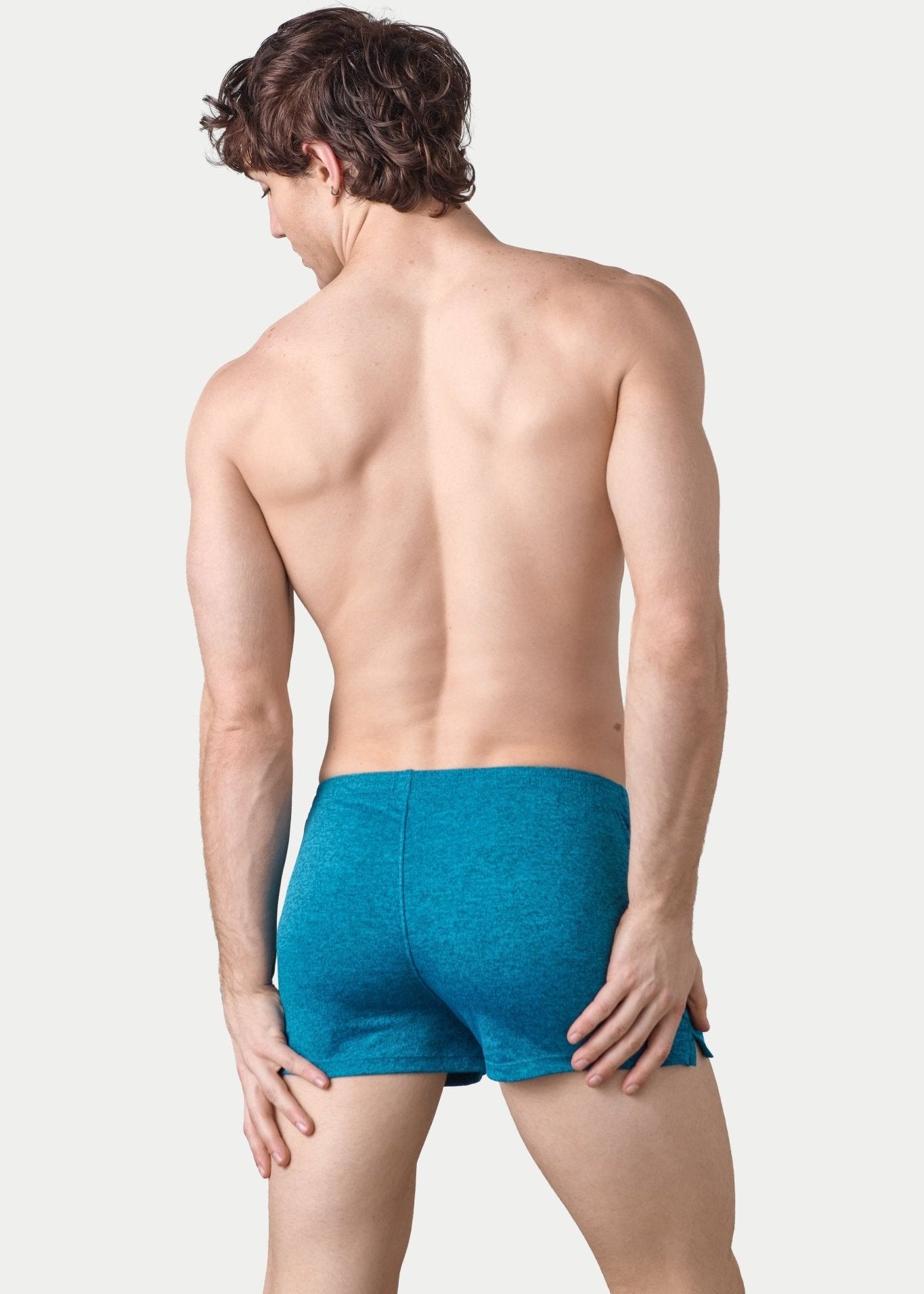 Awry Static Short Azure — close-up of static heather print fabric texture and rubber logo patch