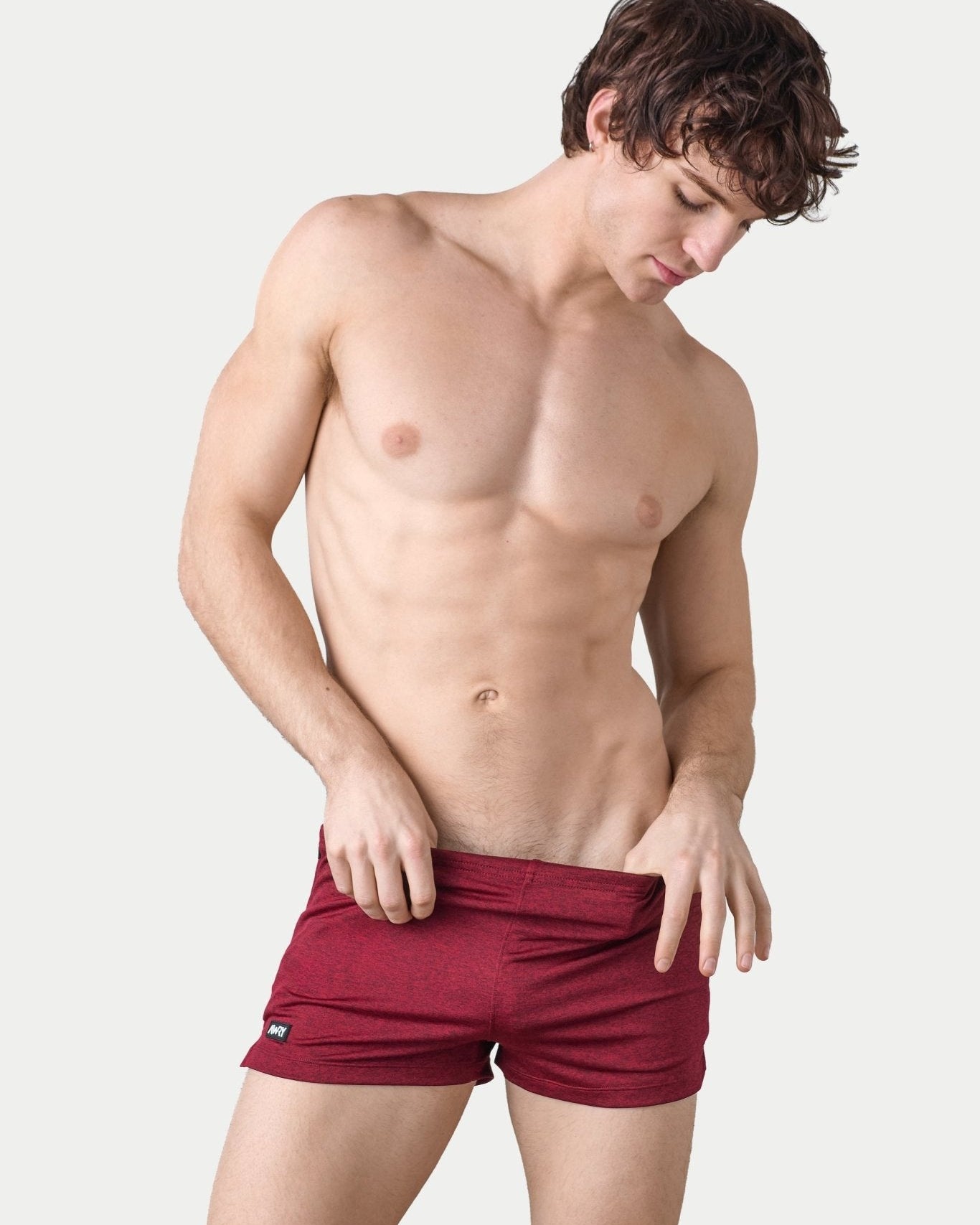 Awry Static Short Red — close-up of static heather print fabric texture and rubber logo patch