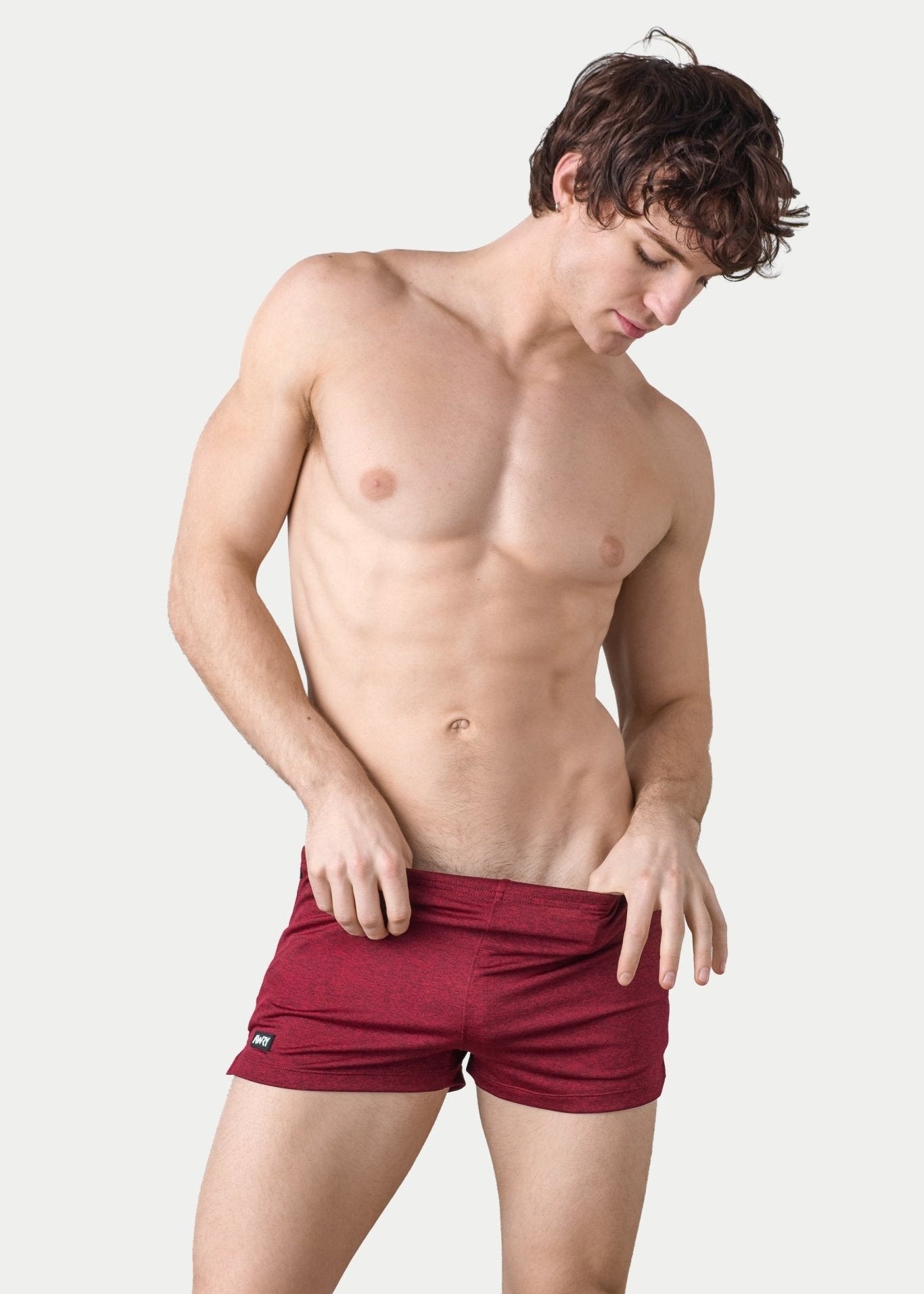 Awry Static Short Red — close-up of static heather print fabric texture and rubber logo patch
