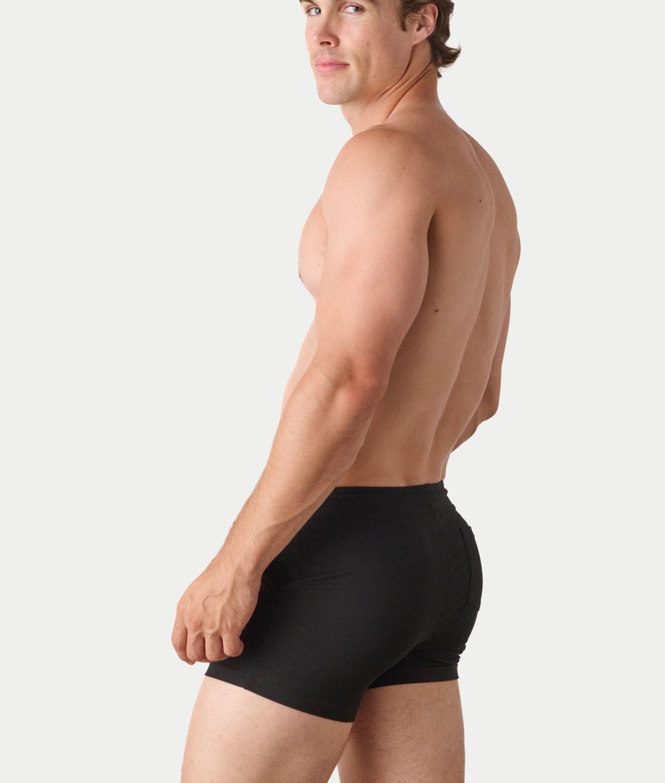 Awry Vers Short V2.1 Black — side view showing roomy front pocket and drawstring waistband