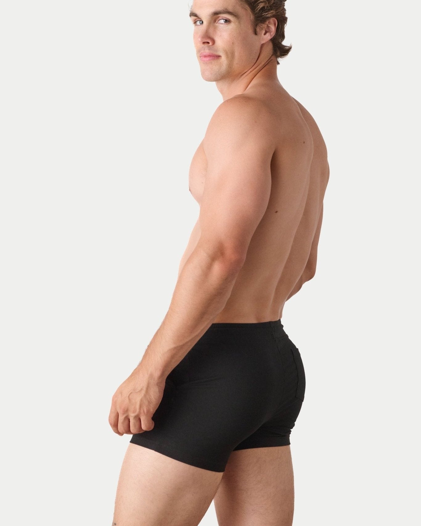 Awry Vers Short V2.1 Black — side view showing roomy front pocket and drawstring waistband
