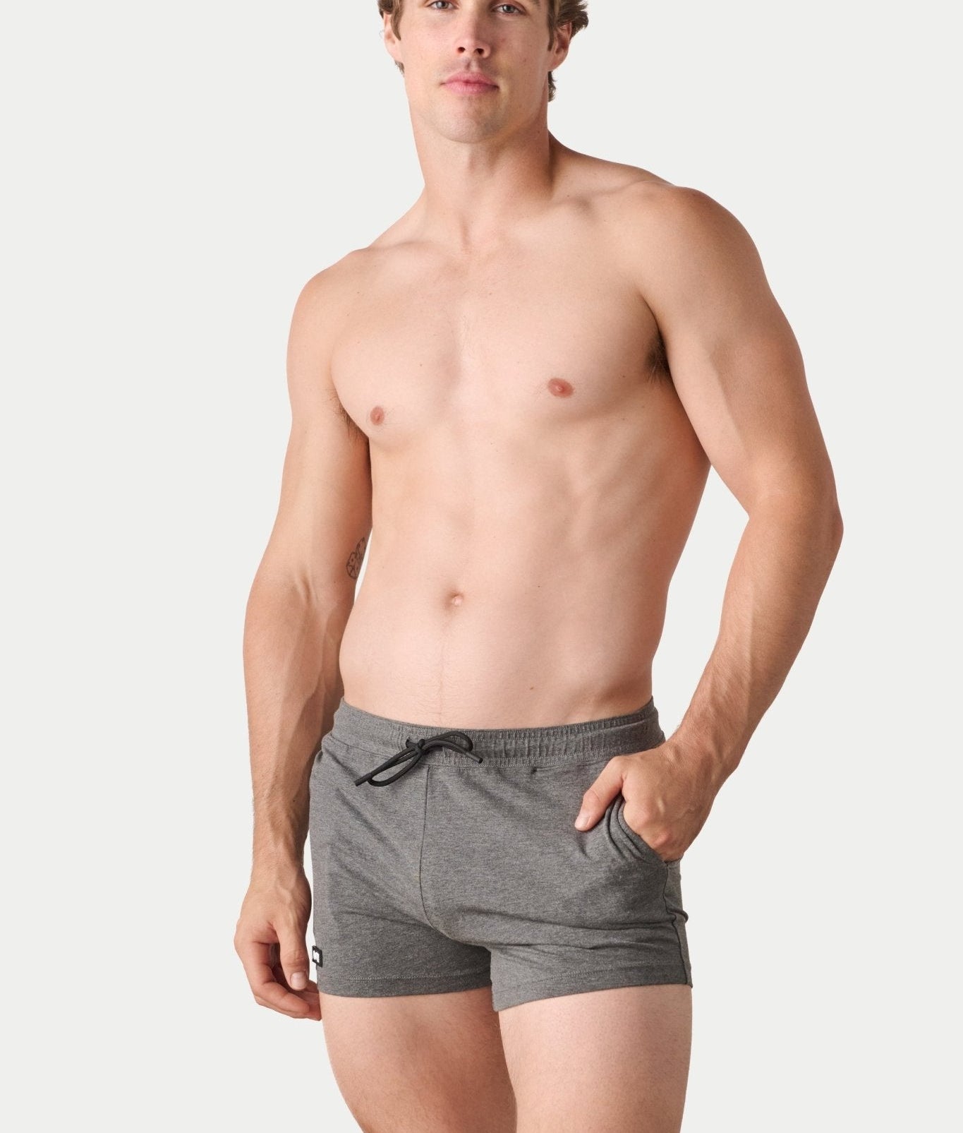 Awry Vers Short V2.1 Heather Gray — detail of logo patch and molded aglets on improved drawstring