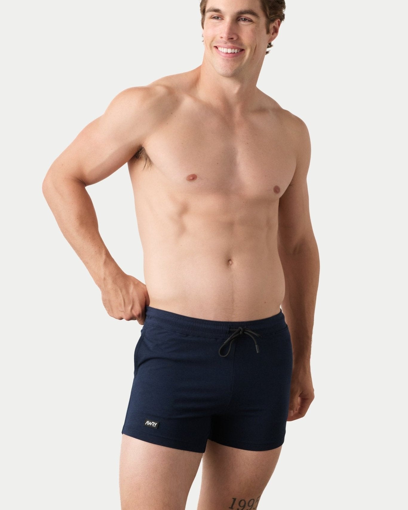 Awry Vers Short V2.1 Navy — side view showing roomy front pocket and drawstring waistband
