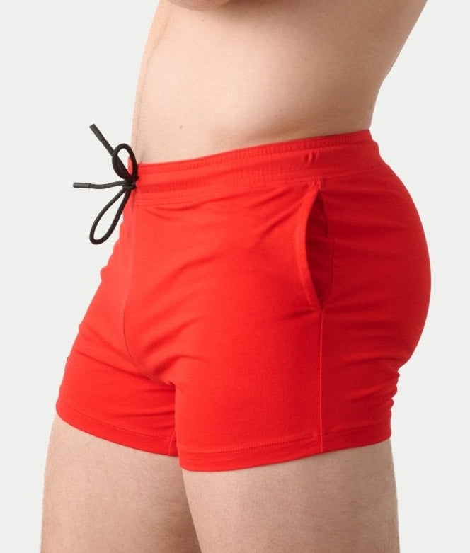 Awry Vers Short V2.1 Red — side view showing roomy front pocket and drawstring waistband