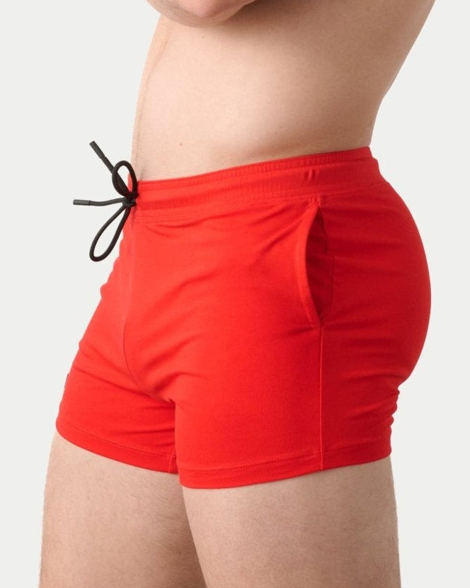 Awry Vers Short V2.1 Red — side view showing roomy front pocket and drawstring waistband