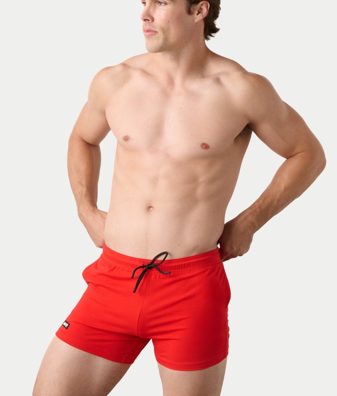 Awry Vers Short V2.1 Red — detail of logo patch and molded aglets on improved drawstring