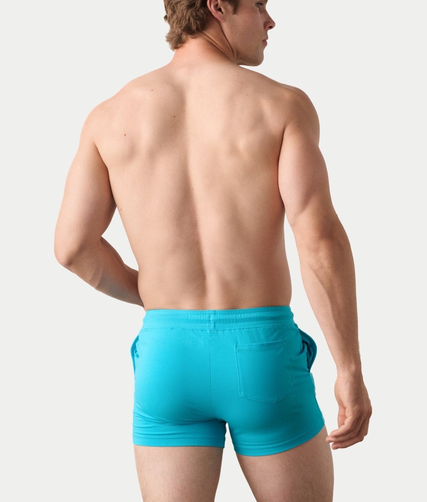 Awry Vers Short V2.1 Sky Blue — detail of logo patch and molded aglets on improved drawstring