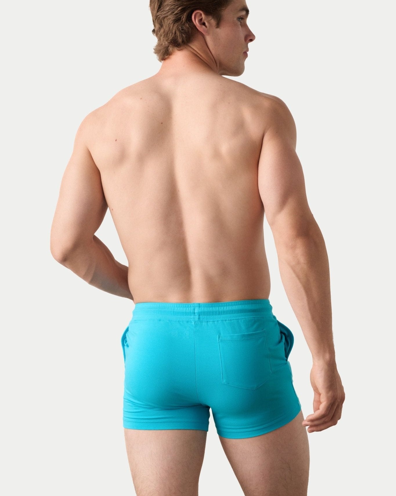Awry Vers Short V2.1 Sky Blue — detail of logo patch and molded aglets on improved drawstring