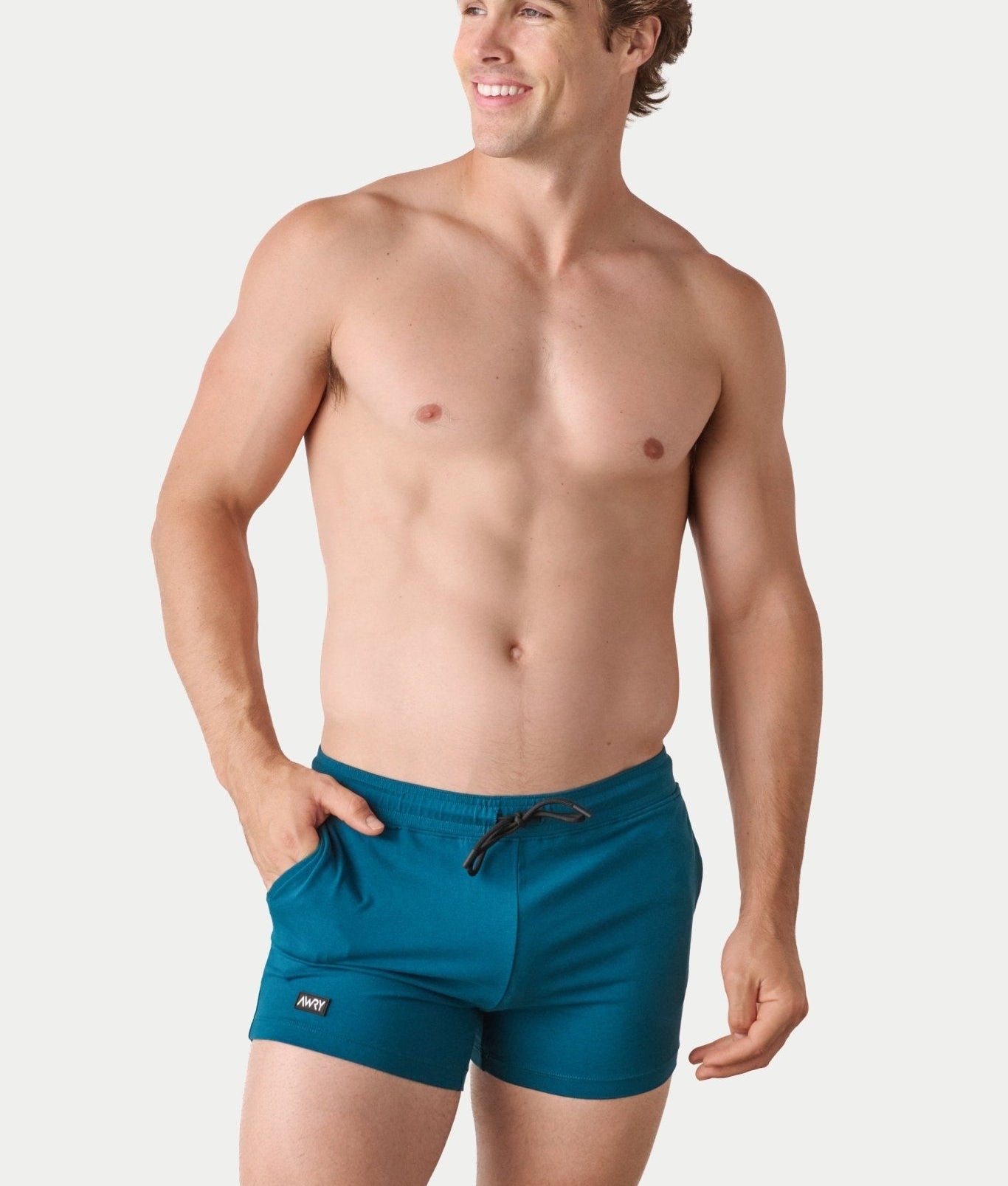 Awry Vers Short V2.1 Teal — detail of logo patch and molded aglets on improved drawstring