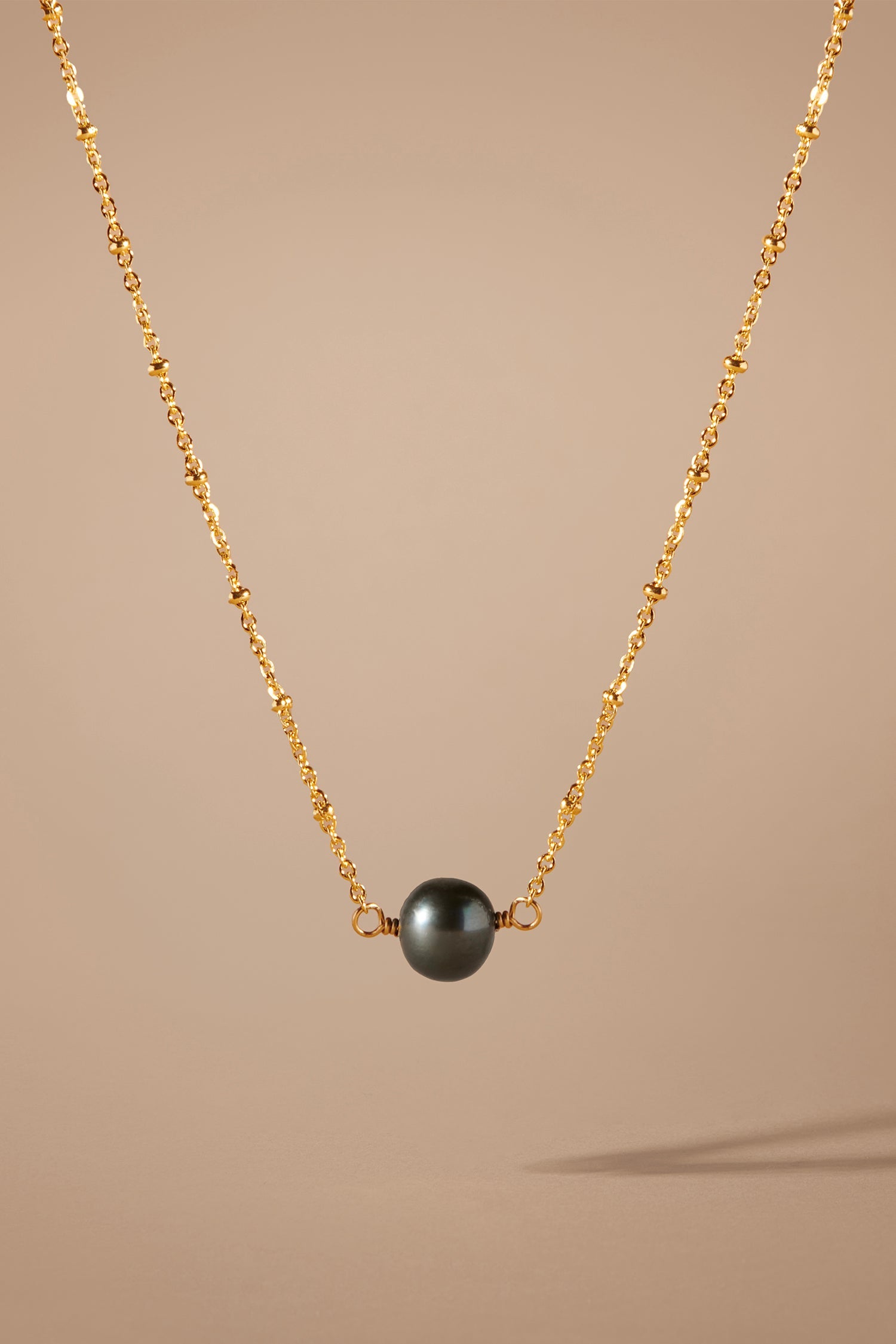 Etalon One Black Pearl Necklace - close-up of rare black freshwater pearl and chain detail
