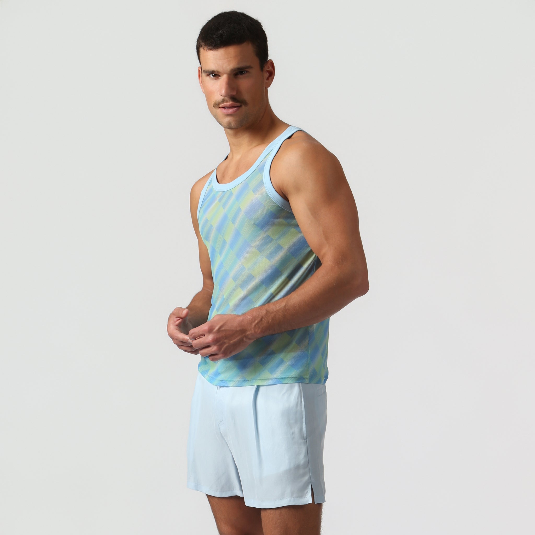 Parke & Ronen Azure Twilo Print Mesh Roxy Tank Azure — men's mesh Roxy tank on model, side view