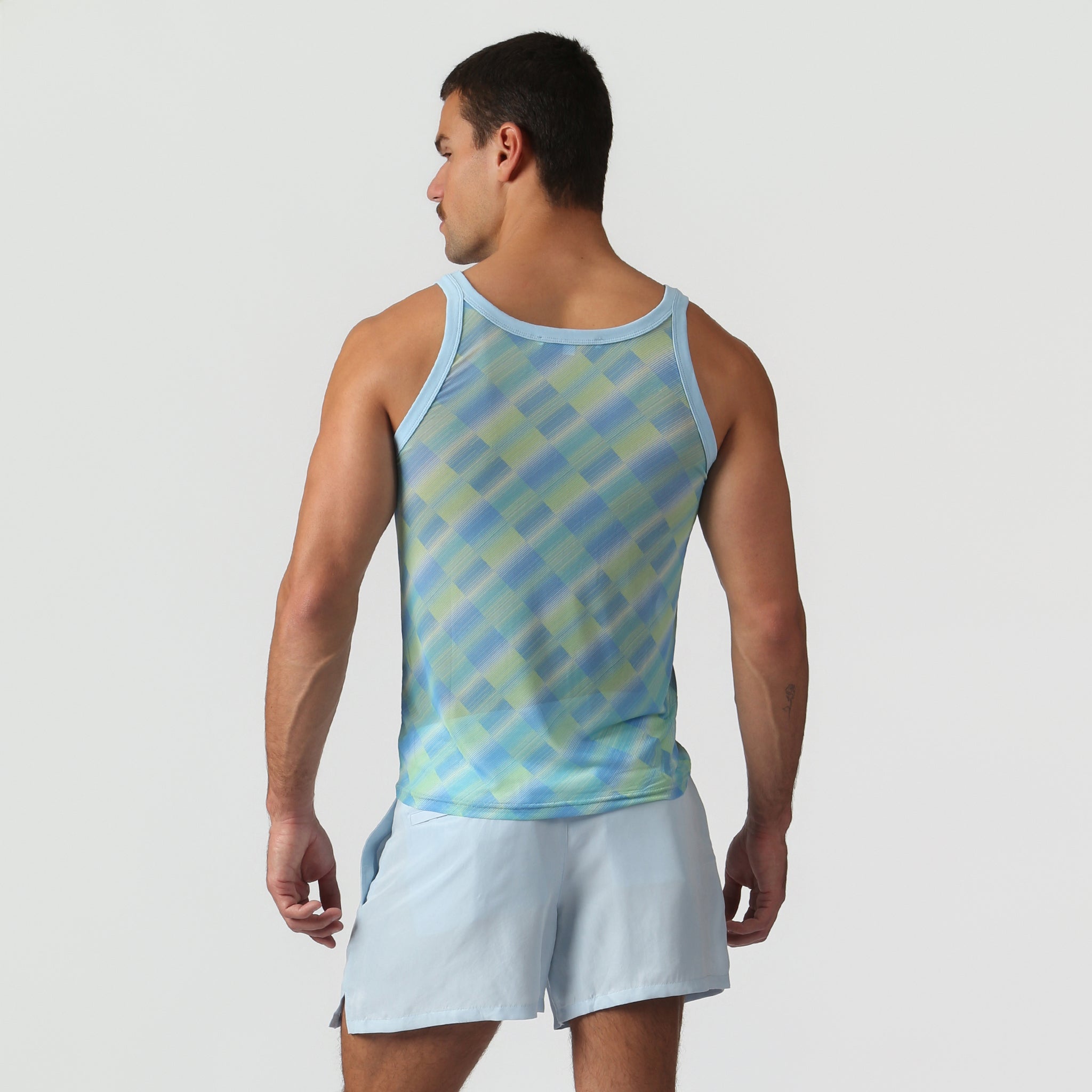 Parke & Ronen Azure Twilo Print Mesh Roxy Tank Azure — men's mesh tank on model, back view