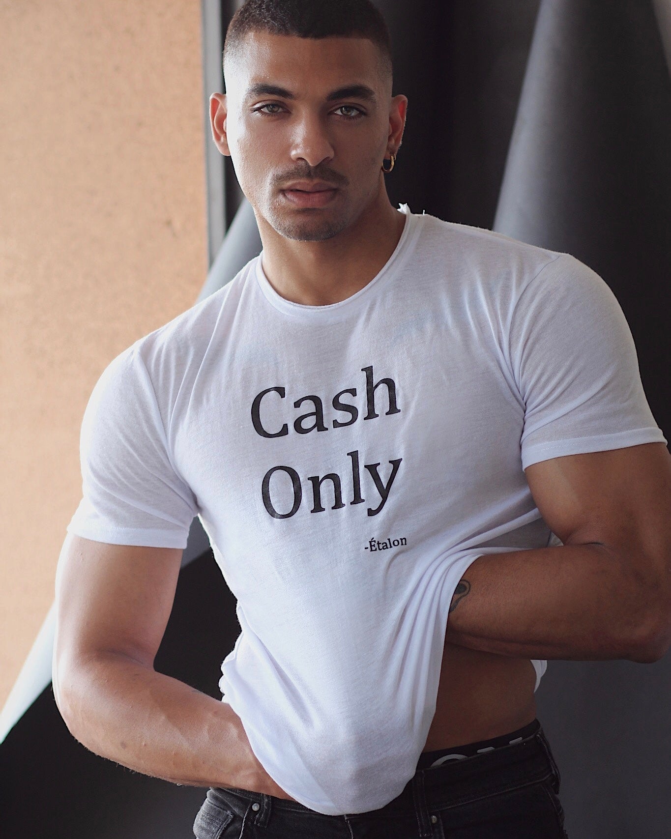 Etalon Cash Only Tee side profile — body-forming fit polyester detail