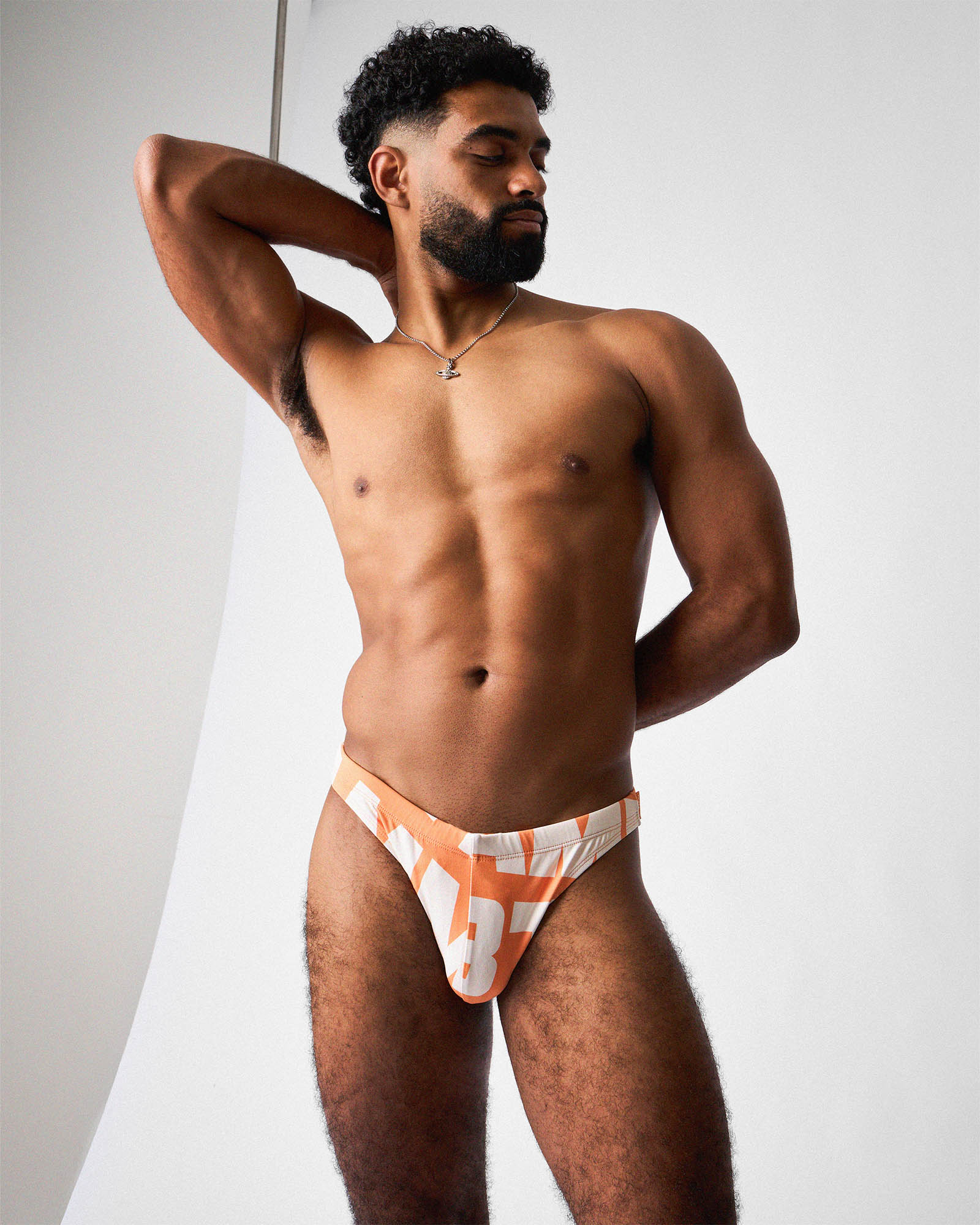 Teamm8 Headliner Bikini Swim Brief Orange - men's swim brief flat lay, product view