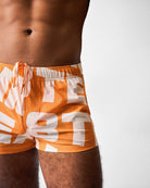 Teamm8 Headliner Swim Short Orange - side pocket detail, men's swim shorts