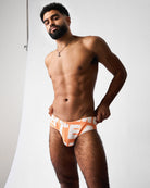 Teamm8 Headliner Wide Swim Brief Orange - men's deconstructed logo print swim brief, lifestyle