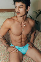 Étalon Aqua Swim Sunga - men's swim brief seated at pool, front angle