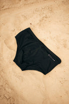Étalon Black Swim Sunga - men's swim brief action shot by water