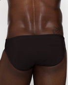 Sean & Val Classic Brief Black — men's swim brief lifestyle shot at beach or pool