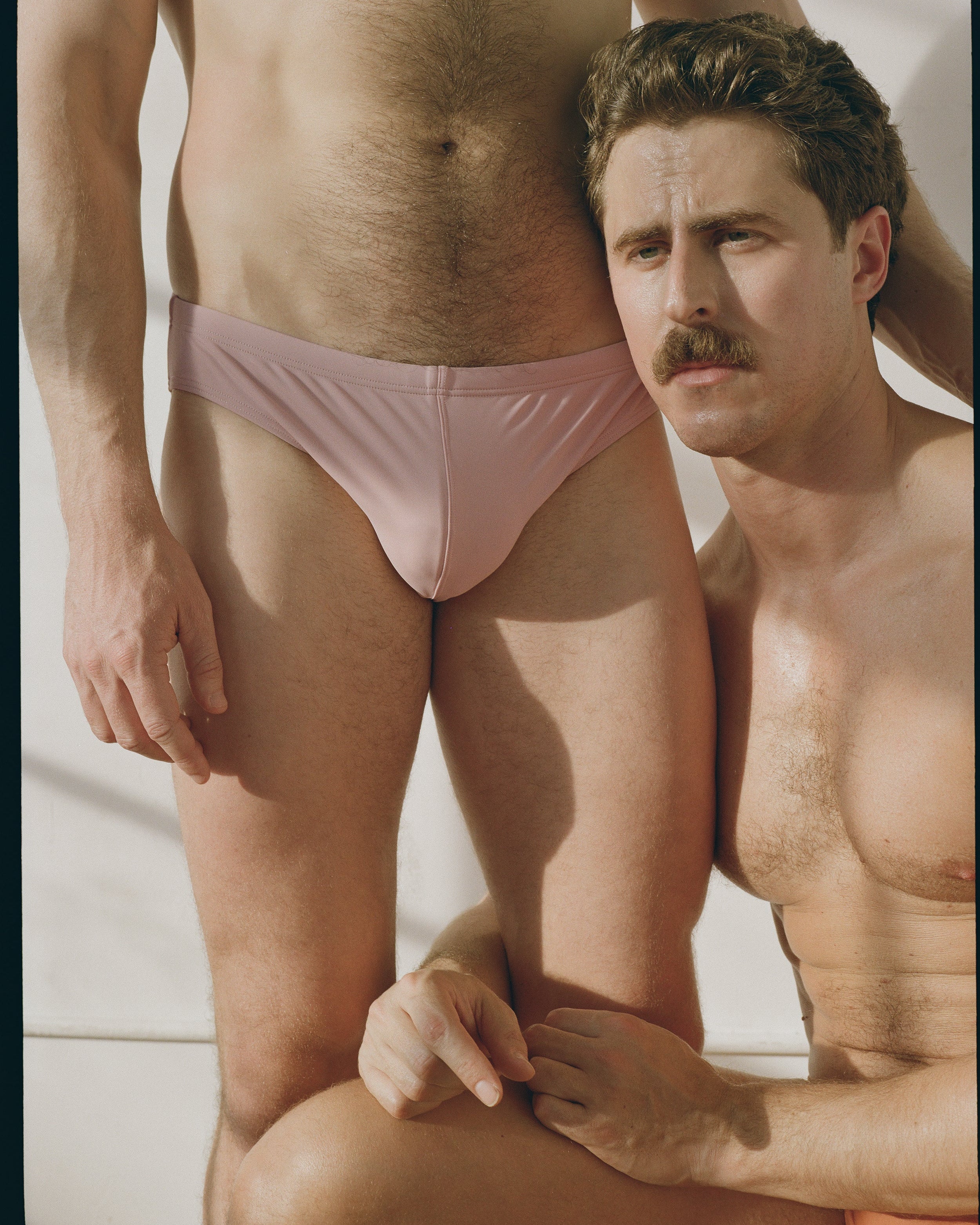 Sean & Val Racer Brief Paloma — men's swim brief worn in group lifestyle shot