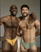 Sean & Val Racer Brief Sunflower — men's swim brief worn in group lifestyle shot