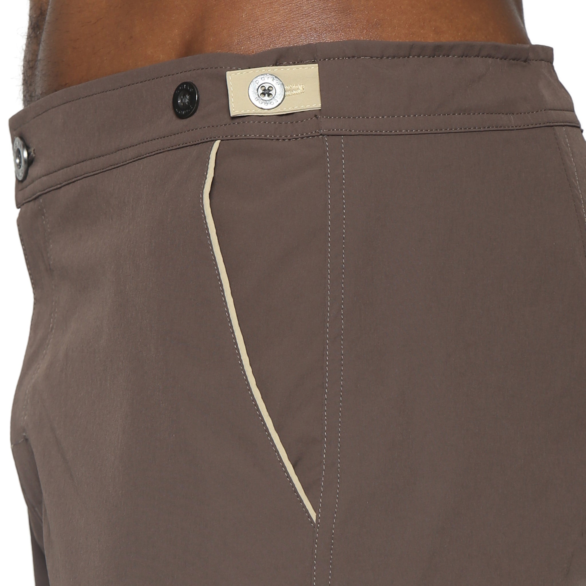 Parke & Ronen Catalonia Espresso Stretch Swim Short - close-up of accent waist tab detail