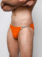 Nero New York Twin Chain Brief Ember Orange - men's twin chain swim brief with chrome chains and removable O-rings, side view