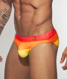 Addicted Rainbow AD Bikini Brief Red - men's swim brief detail of elastic waistband with Pride graphic branding, side view
