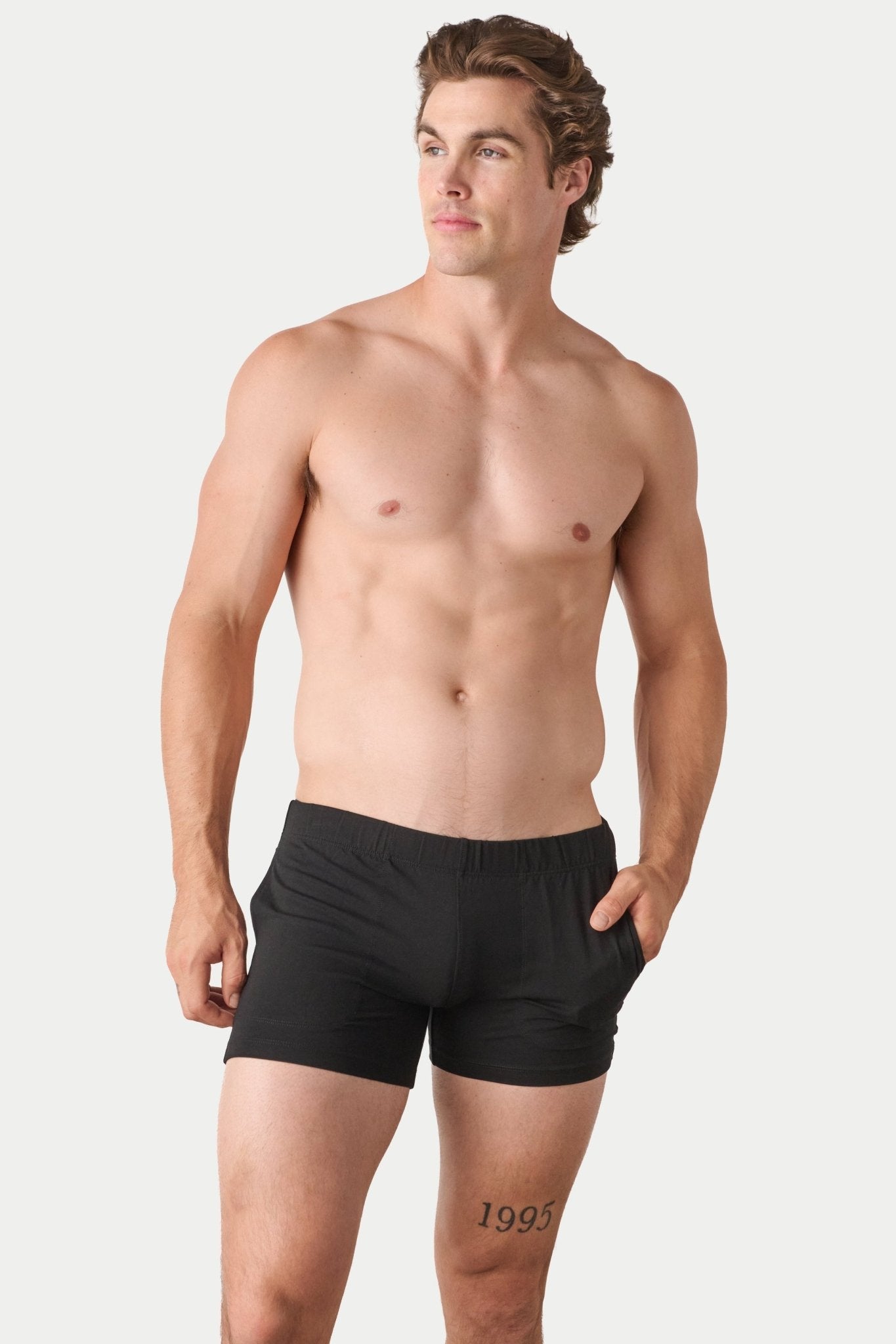 Awry Flow 4 Inch Short V2 Black — close-up of bamboo-cotton fabric texture and form-fitting leg opening