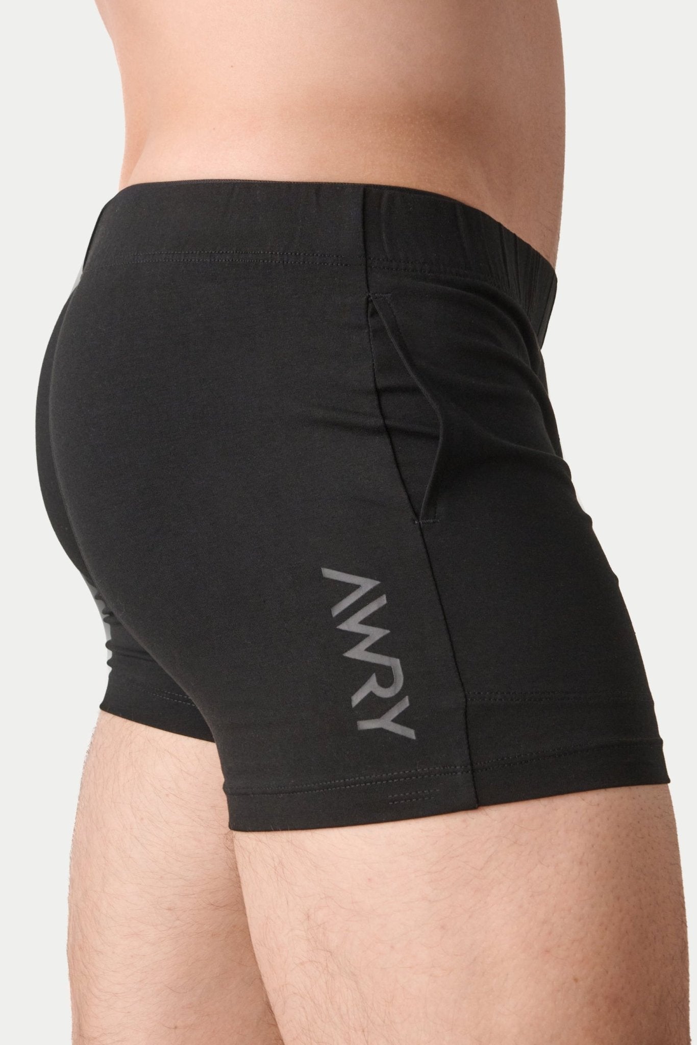 Awry Flow 4 Inch Short V2 Black — rear view showing extra-high inseam and glute-sculpting cut