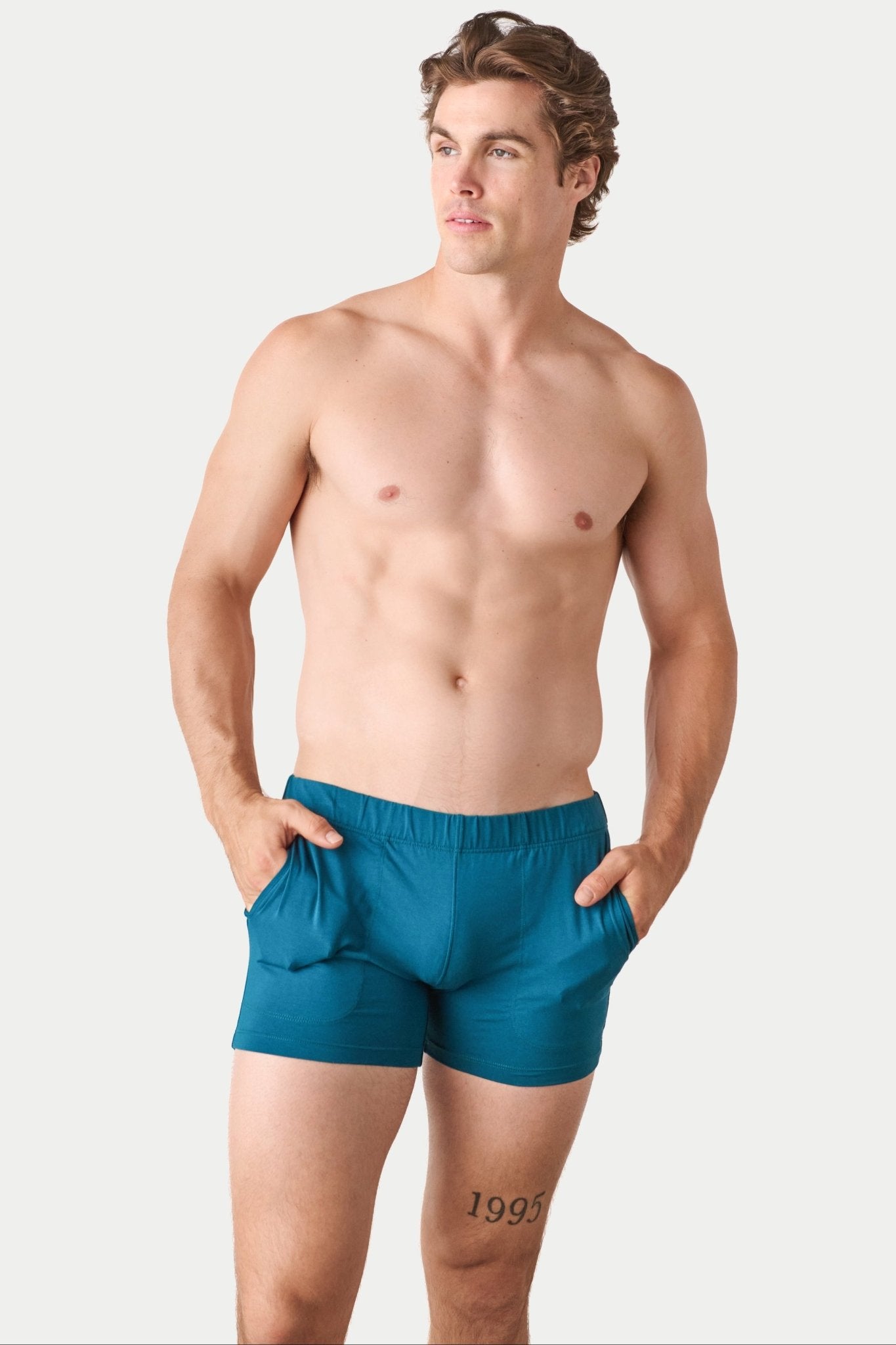 Awry Flow 4 Inch Short V2 Teal — close-up of bamboo-cotton fabric texture and form-fitting leg opening