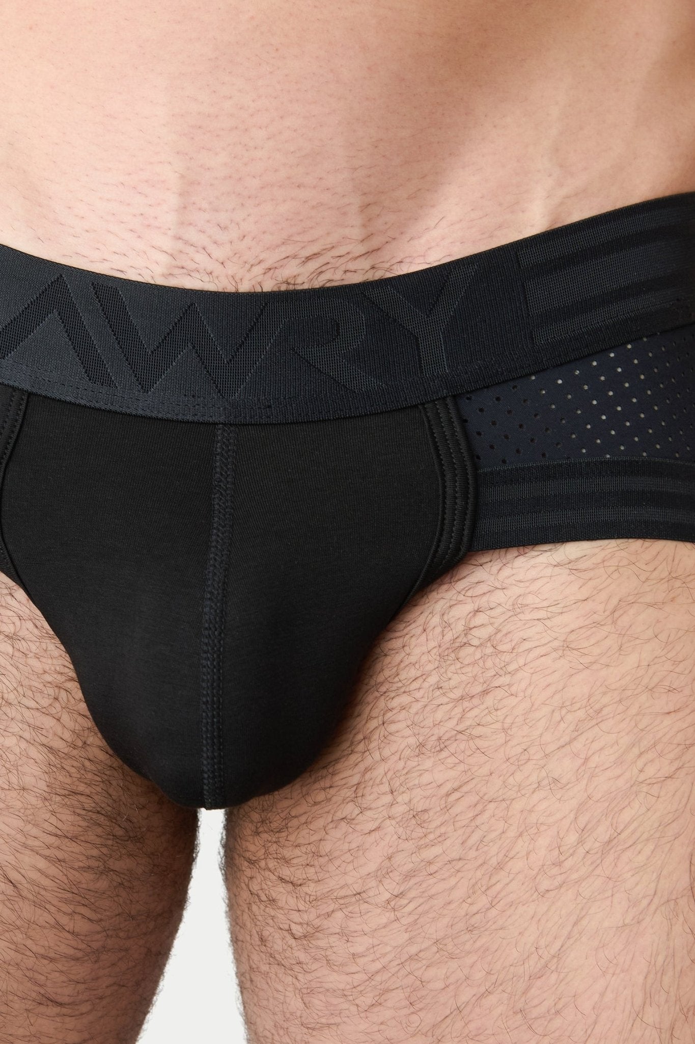 Awry Lift Brief Black — side profile showing 2-ply front pouch and low-rise brief cut