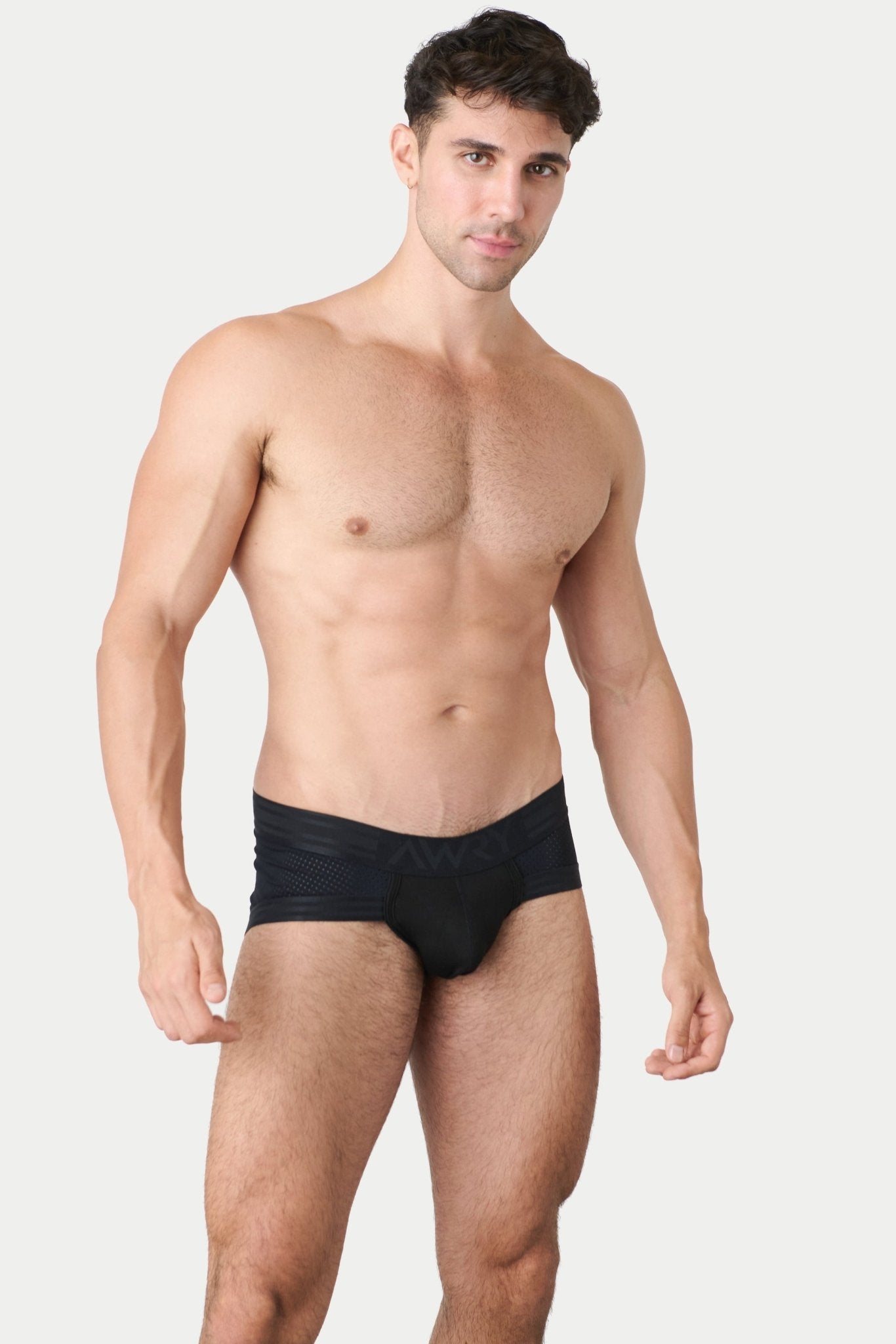 Awry Lift Brief Black — detail shot of branded waistband and 4-way stretch mesh fabric