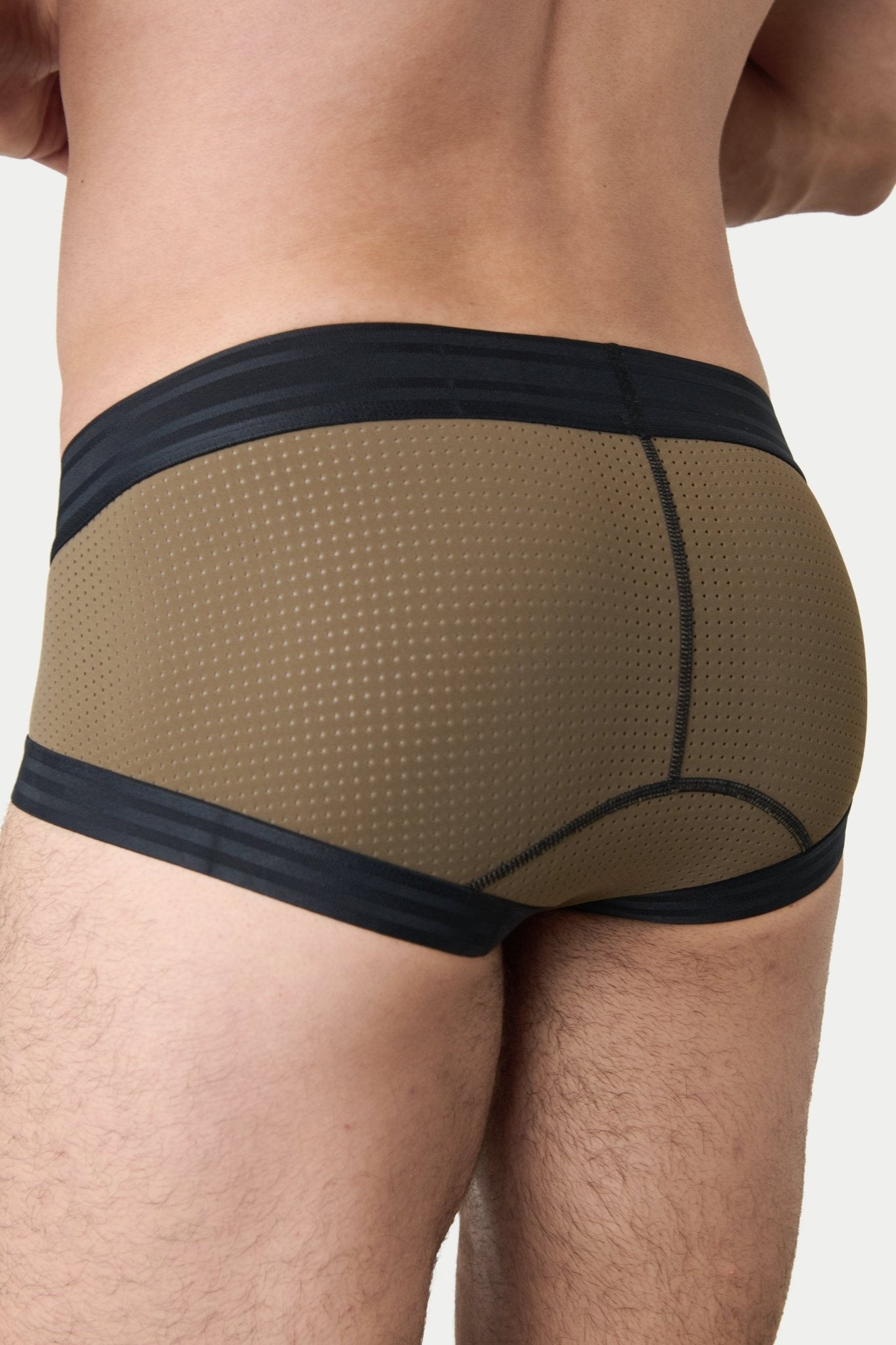 Awry Lift Brief Moss Black - side view showing low-rise silhouette and mesh panels
