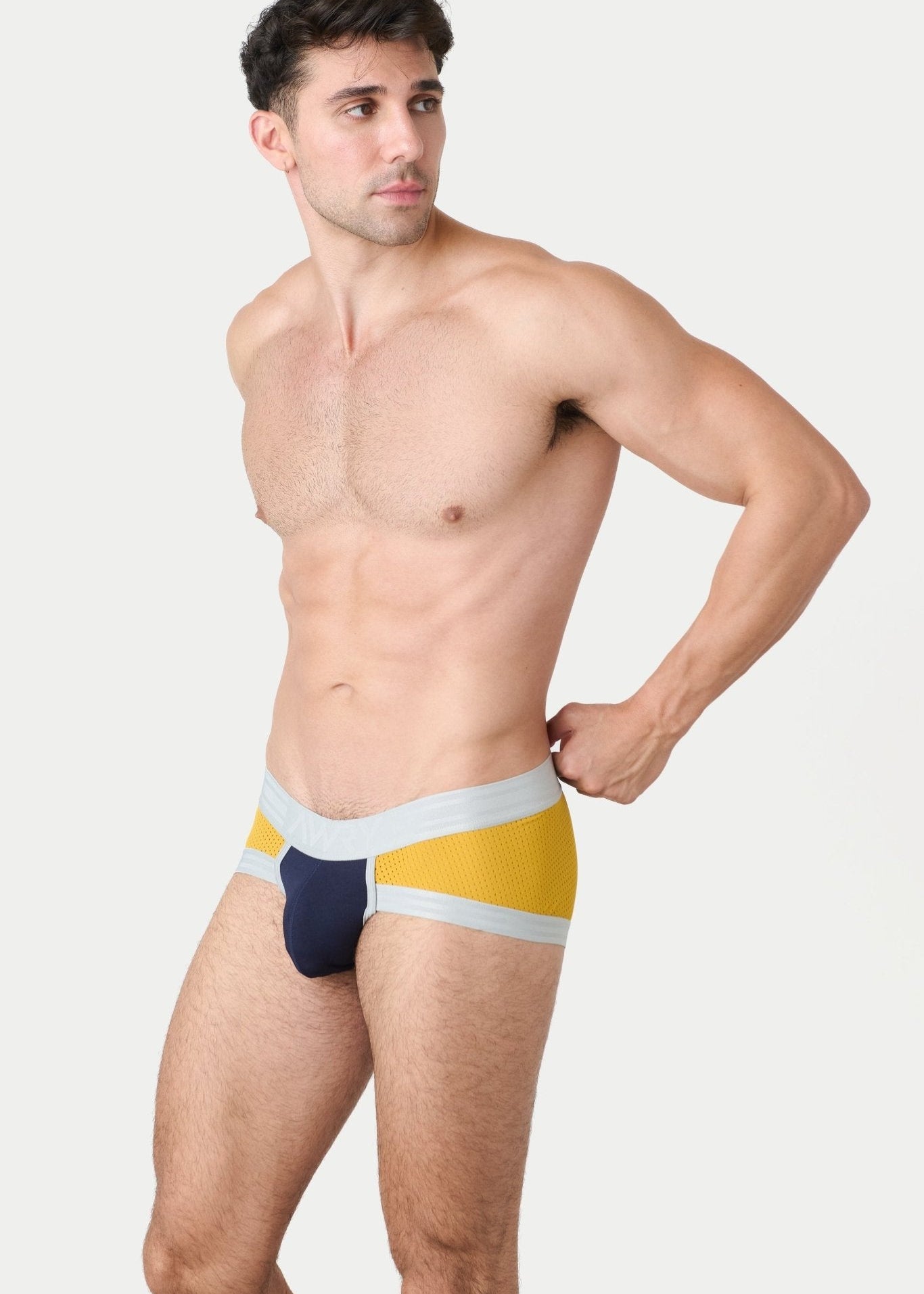 Awry Lift Brief Navy Gold — detail shot of branded waistband and 4-way stretch mesh fabric