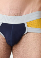 Awry Lift Brief Navy Gold — rear view showing built-in jockstrap strap system and lift construction