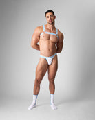 Teamm8 Optic Harness Azure — men's body harness styled for Pride and festival wear, lifestyle shot