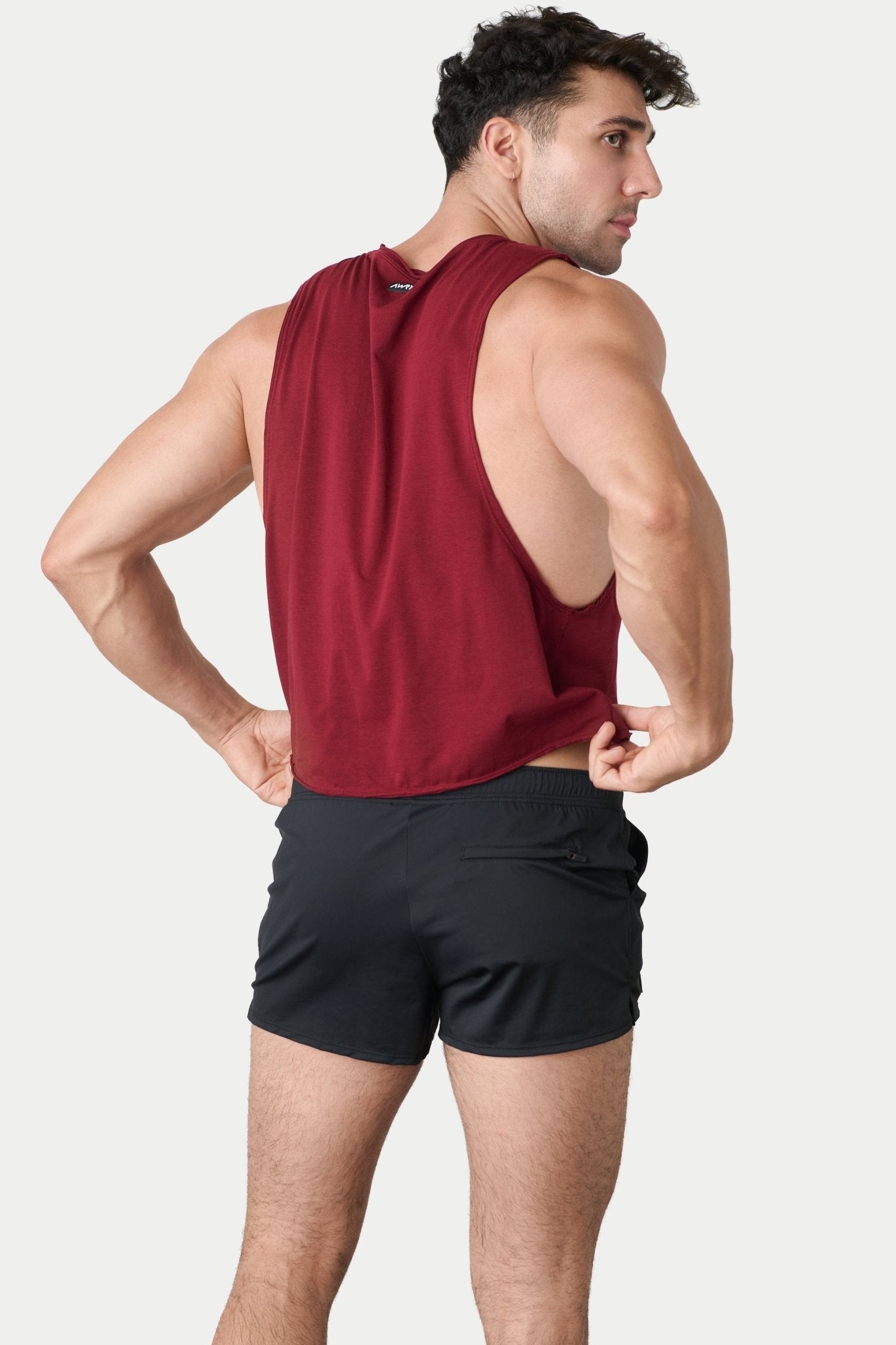 Awry Raw Crop Tank Maroon — close-up of raw unfinished edge at collar and armhole