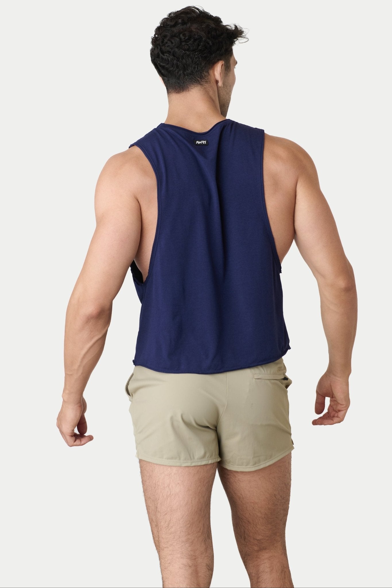 Awry Raw Crop Tank Navy — close-up of raw unfinished edge at collar and armhole