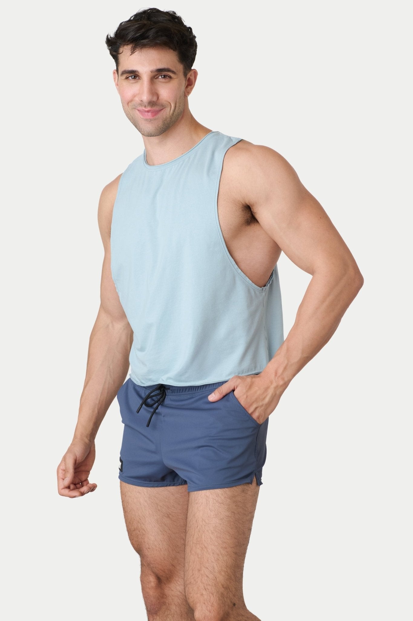 Awry Raw Crop Tank Soft Blue — side view showing cropped midriff-exposing silhouette