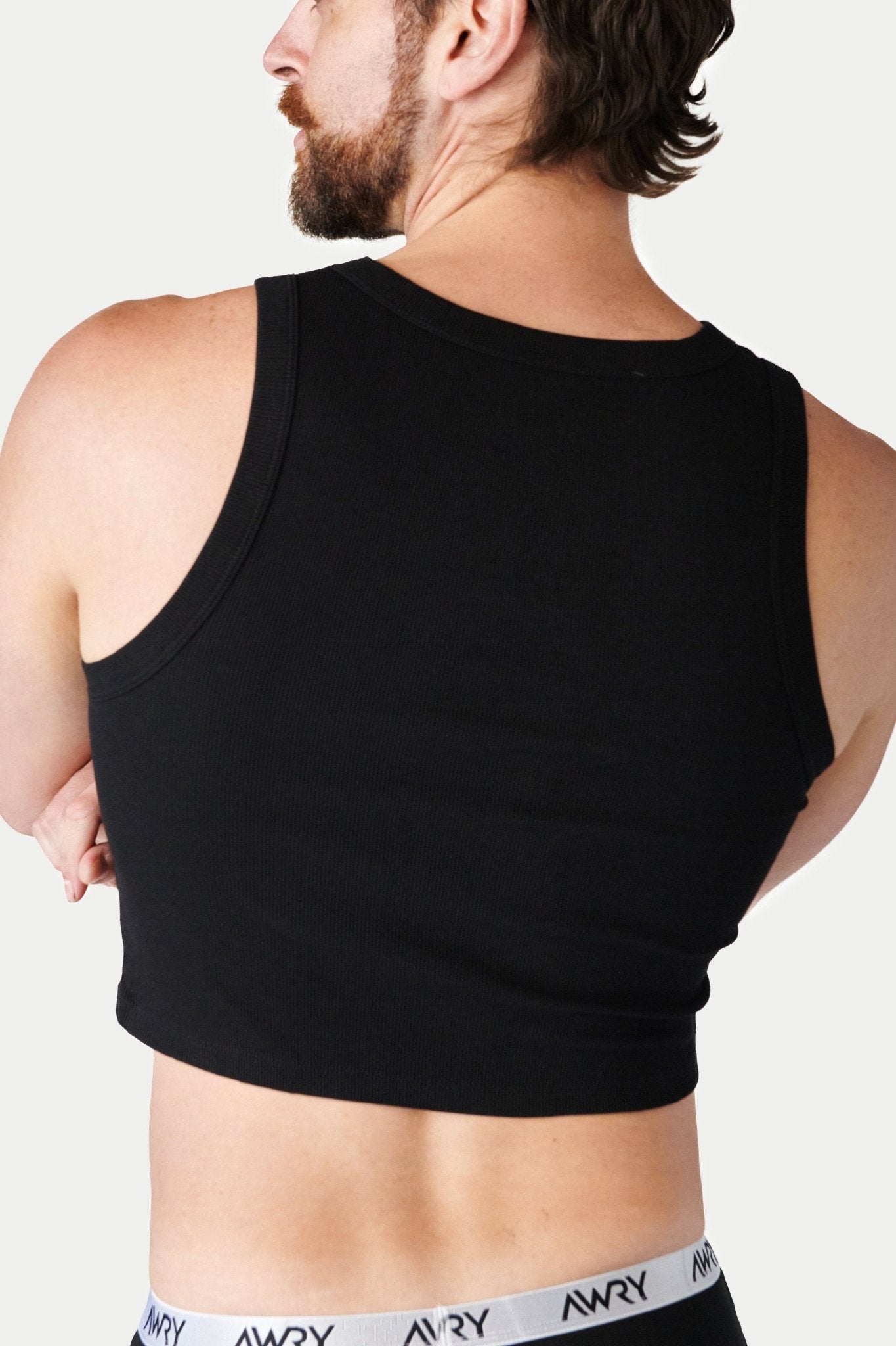 Awry Ribbed Crop Tank Black — close-up of ribbed knit texture and hip-length crop detail