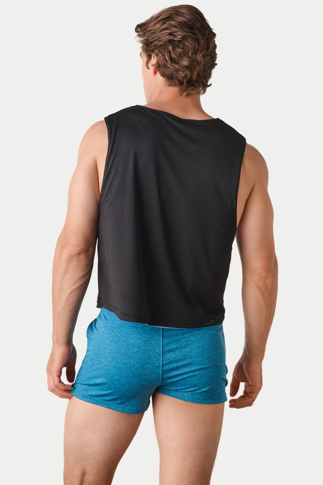 Awry Rookie Reversible Tank Black & Blue — side view showing semi-cropped silhouette and mesh construction