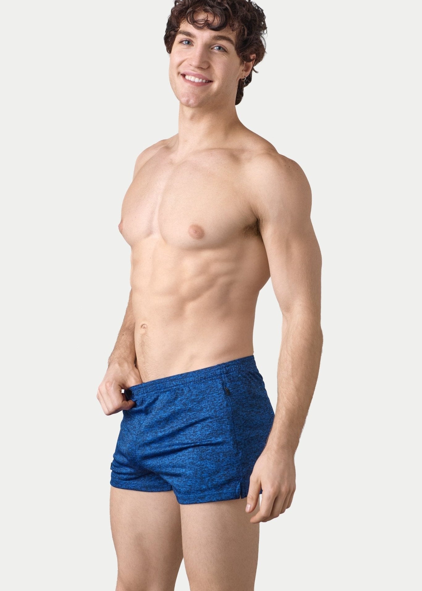 Awry Static Short Blue — close-up of static heather print fabric texture and rubber logo patch