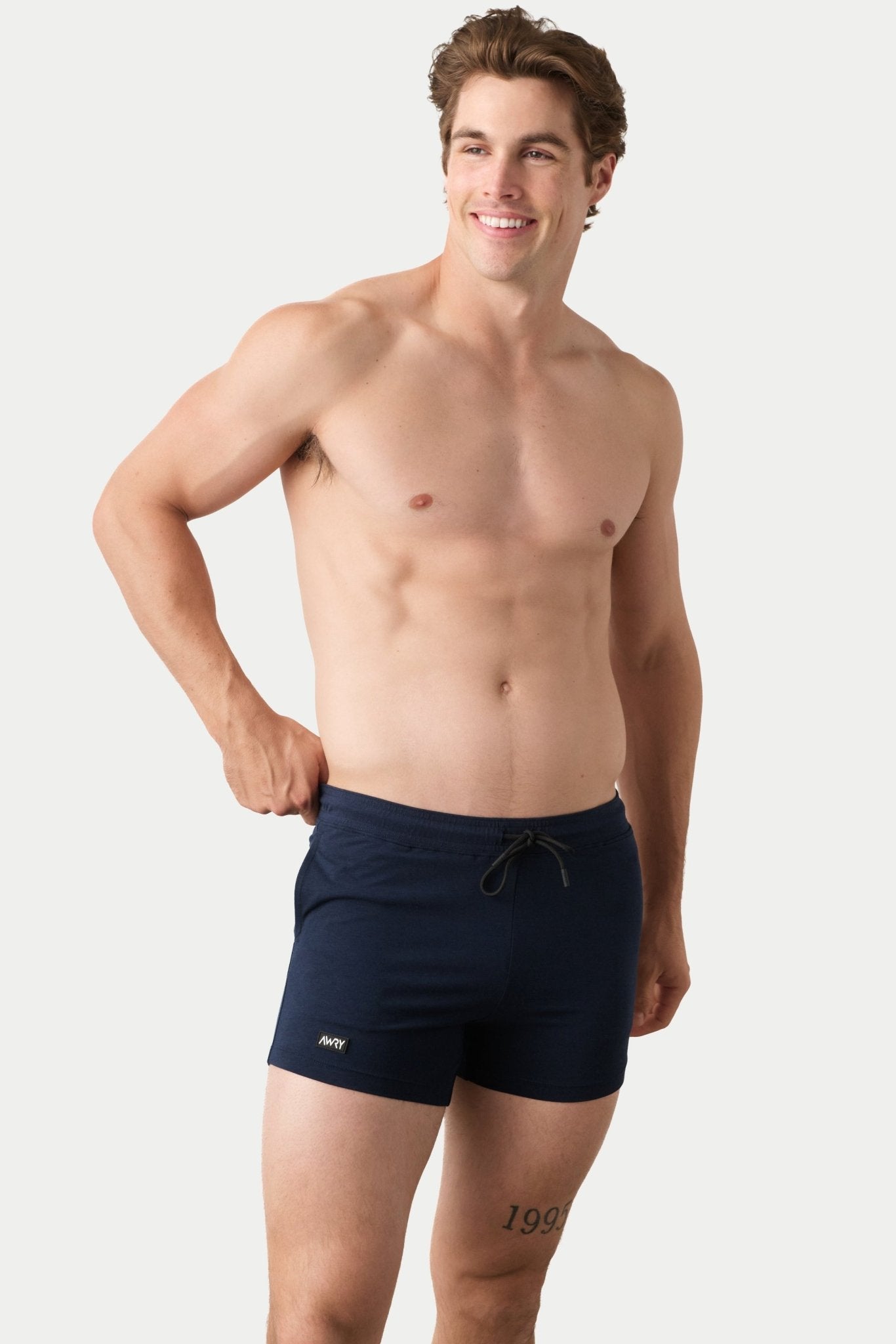 Awry Vers Short V2.1 Navy — side view showing roomy front pocket and drawstring waistband