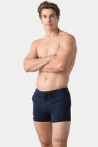 Awry Vers Short V2.1 Navy — detail of logo patch and molded aglets on improved drawstring