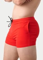 Awry Vers Short V2.1 Red — side view showing roomy front pocket and drawstring waistband