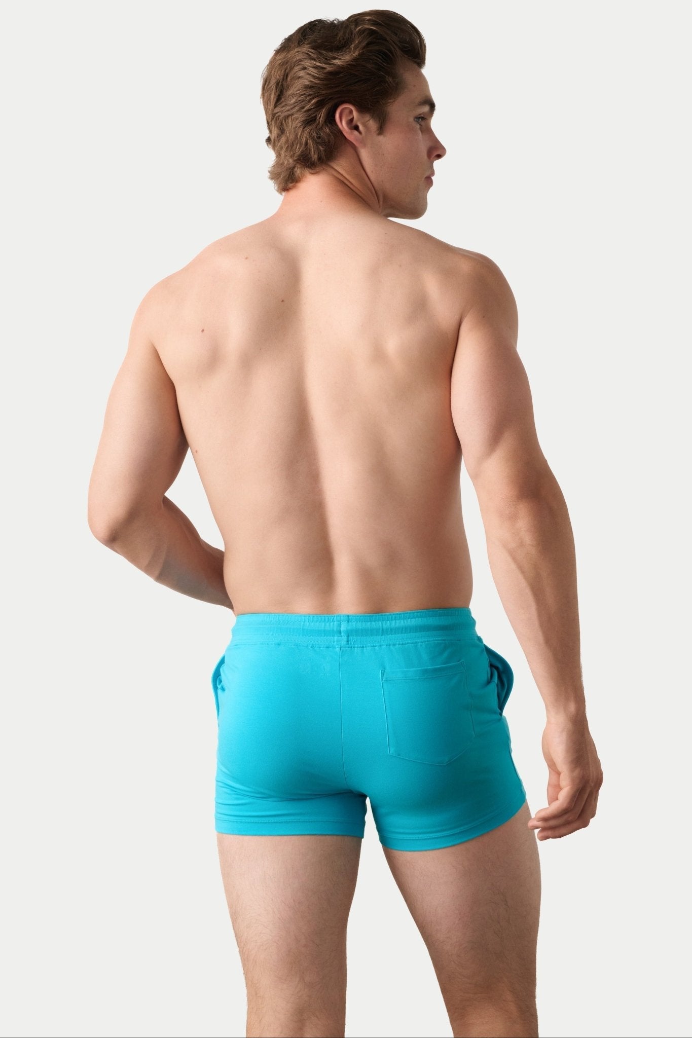 Awry Vers Short V2.1 Sky Blue — detail of logo patch and molded aglets on improved drawstring