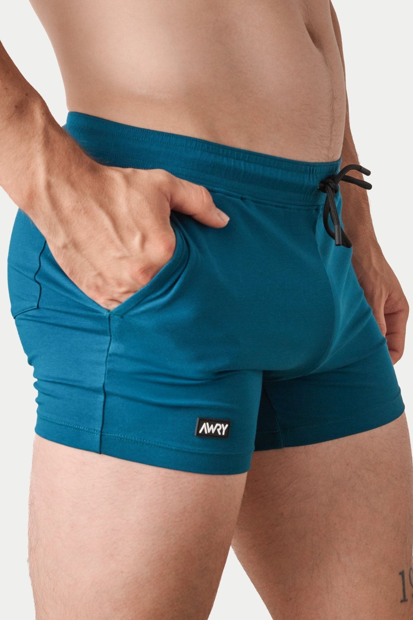 Awry Vers Short V2.1 Teal — rear view highlighting flattering glute-enhancing cut and high inseam